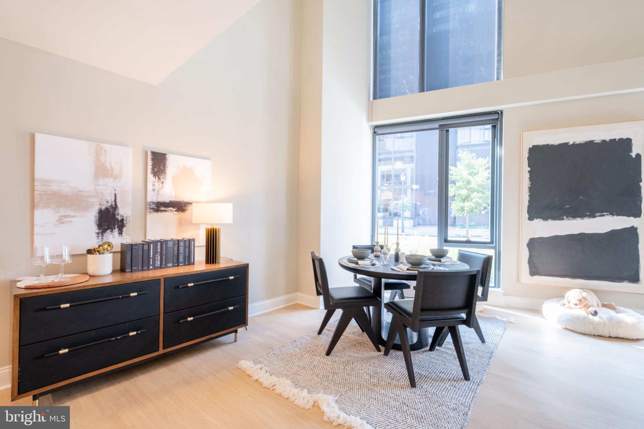 2301-61 John F Kennedy Boulevard, Unit 209 Philadelphia, PA 19103 - Photo 4 of 36 a view of a dining room with furniture and window