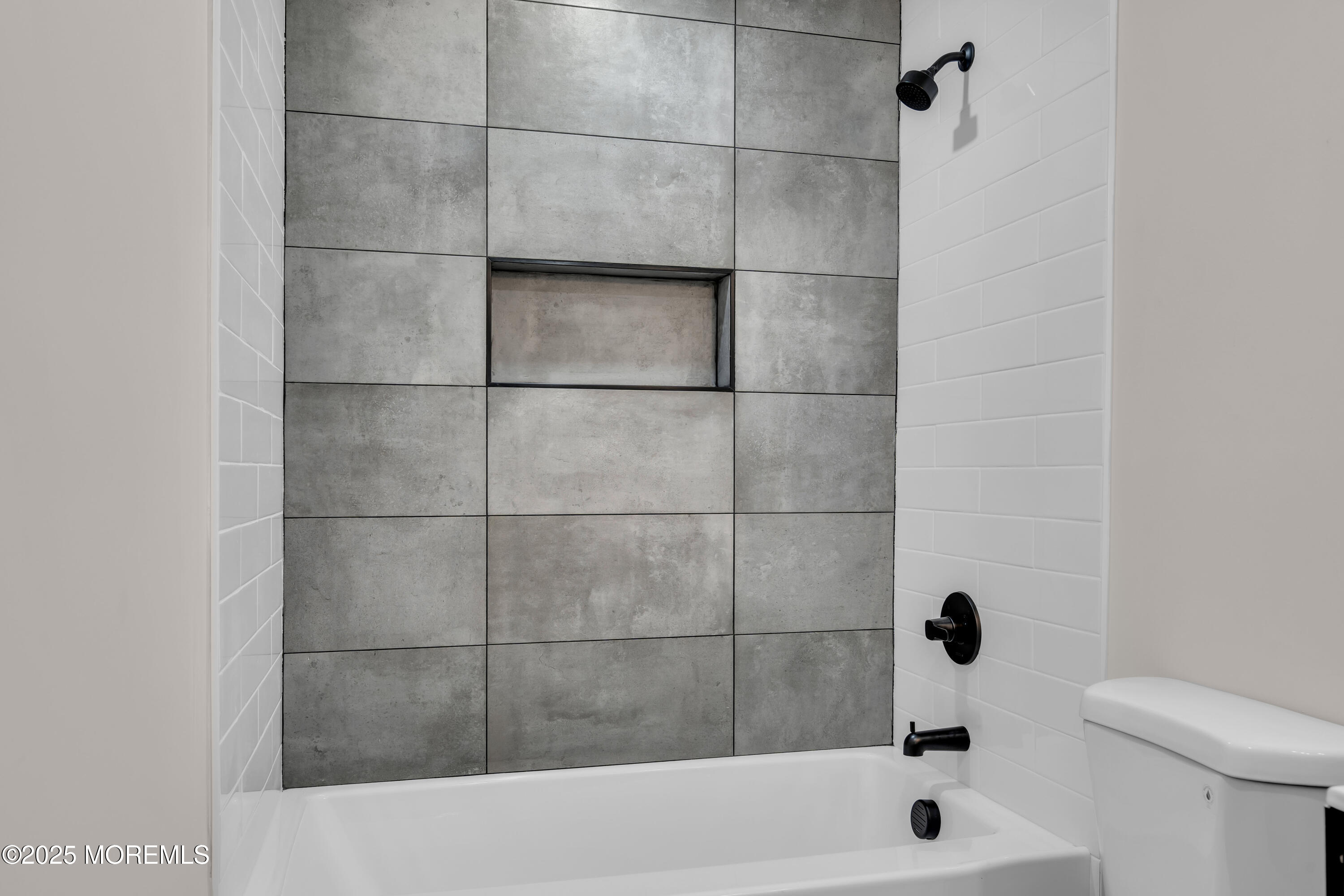 170 Station Road Bayville, NJ 08721 - Photo 15 of 36 a bathroom with a bathtub and a toilet