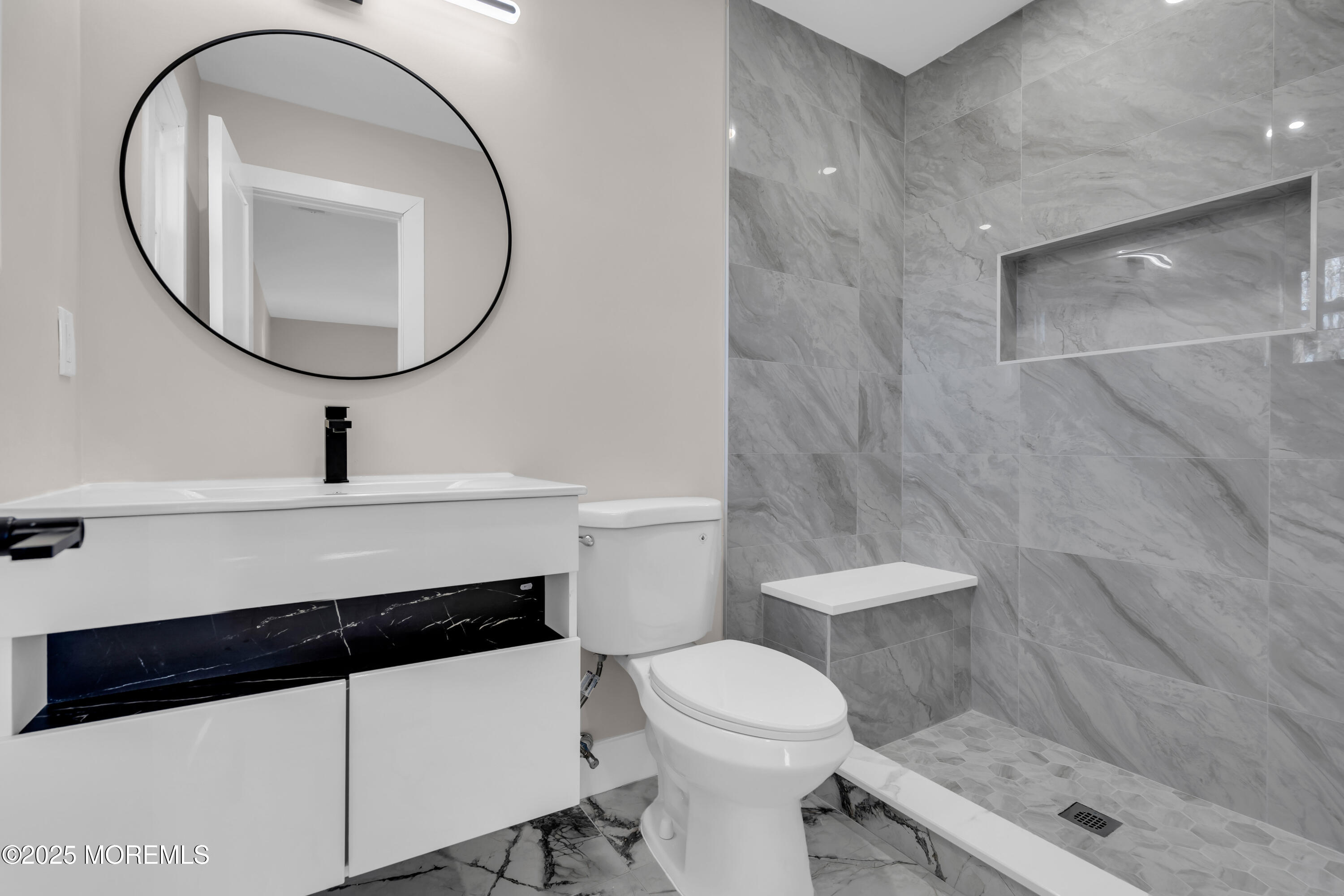 170 Station Road Bayville, NJ 08721 - Photo 19 of 36 a bathroom with a toilet a sink and a mirror