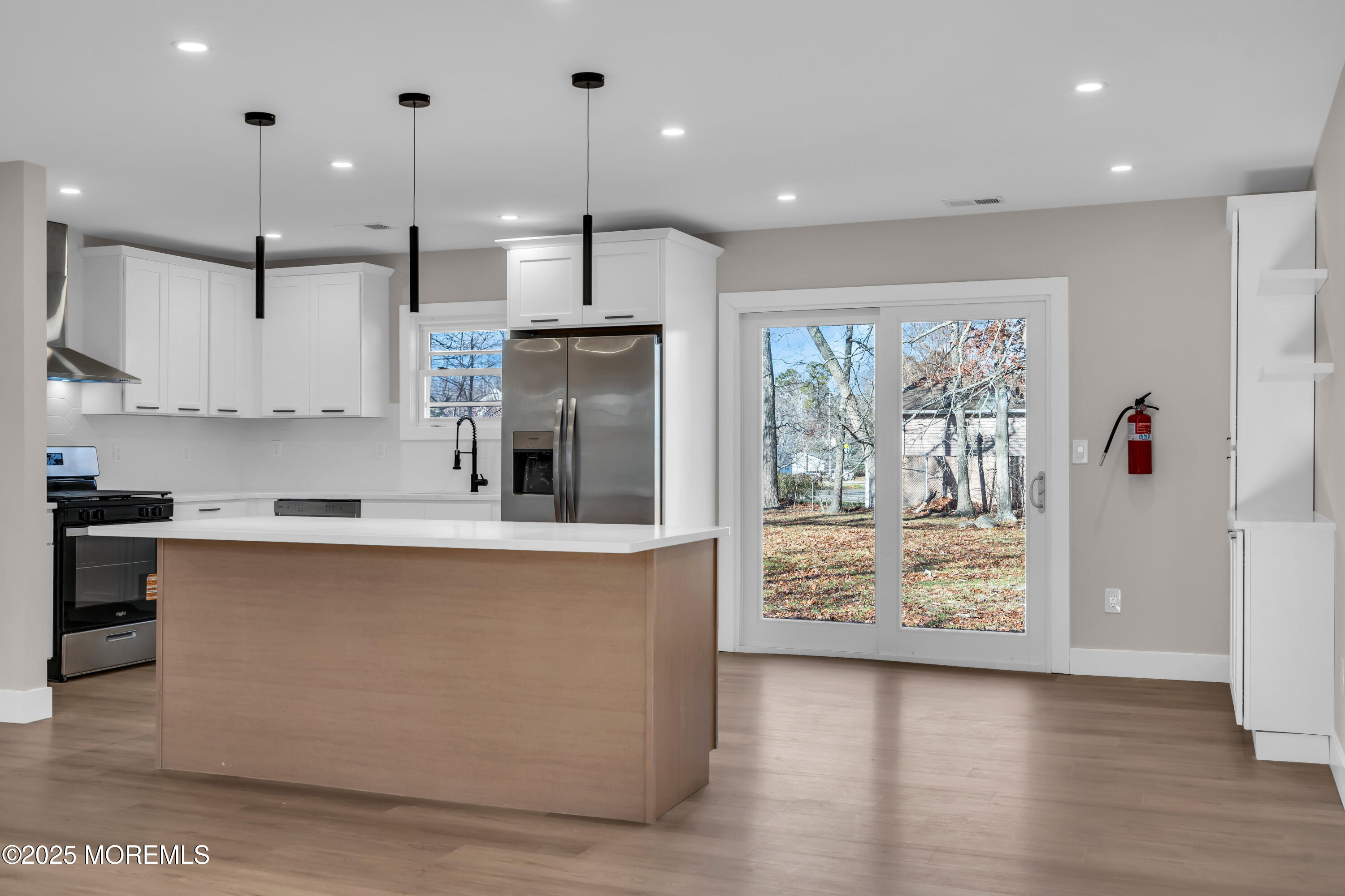170 Station Road Bayville, NJ 08721 - Photo 2 of 36 a large kitchen with stainless steel appliances granite countertop a stove a sink and a refrigerator