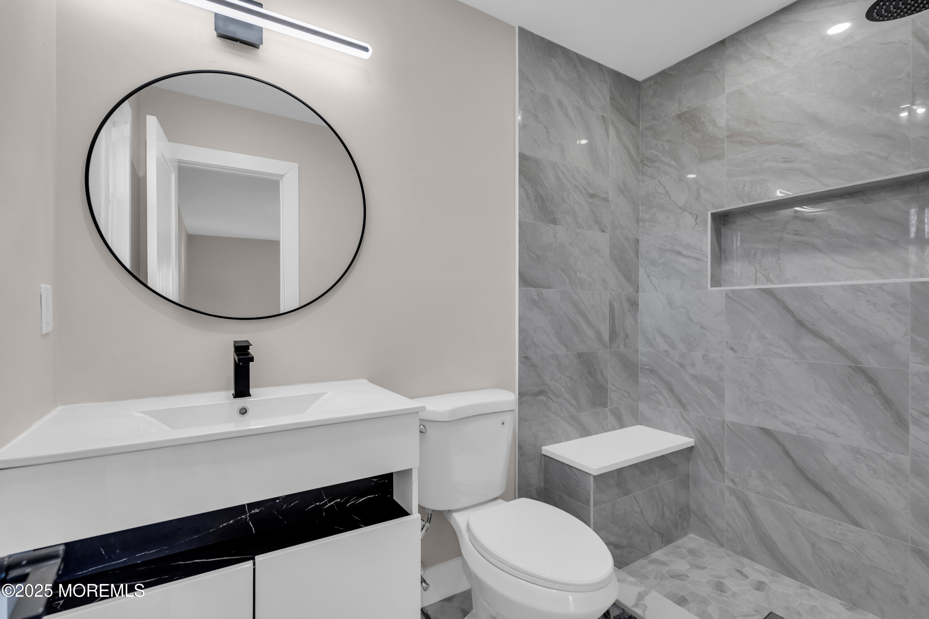 170 Station Road Bayville, NJ 08721 - Photo 21 of 36 a bathroom with a sink a toilet and a mirror