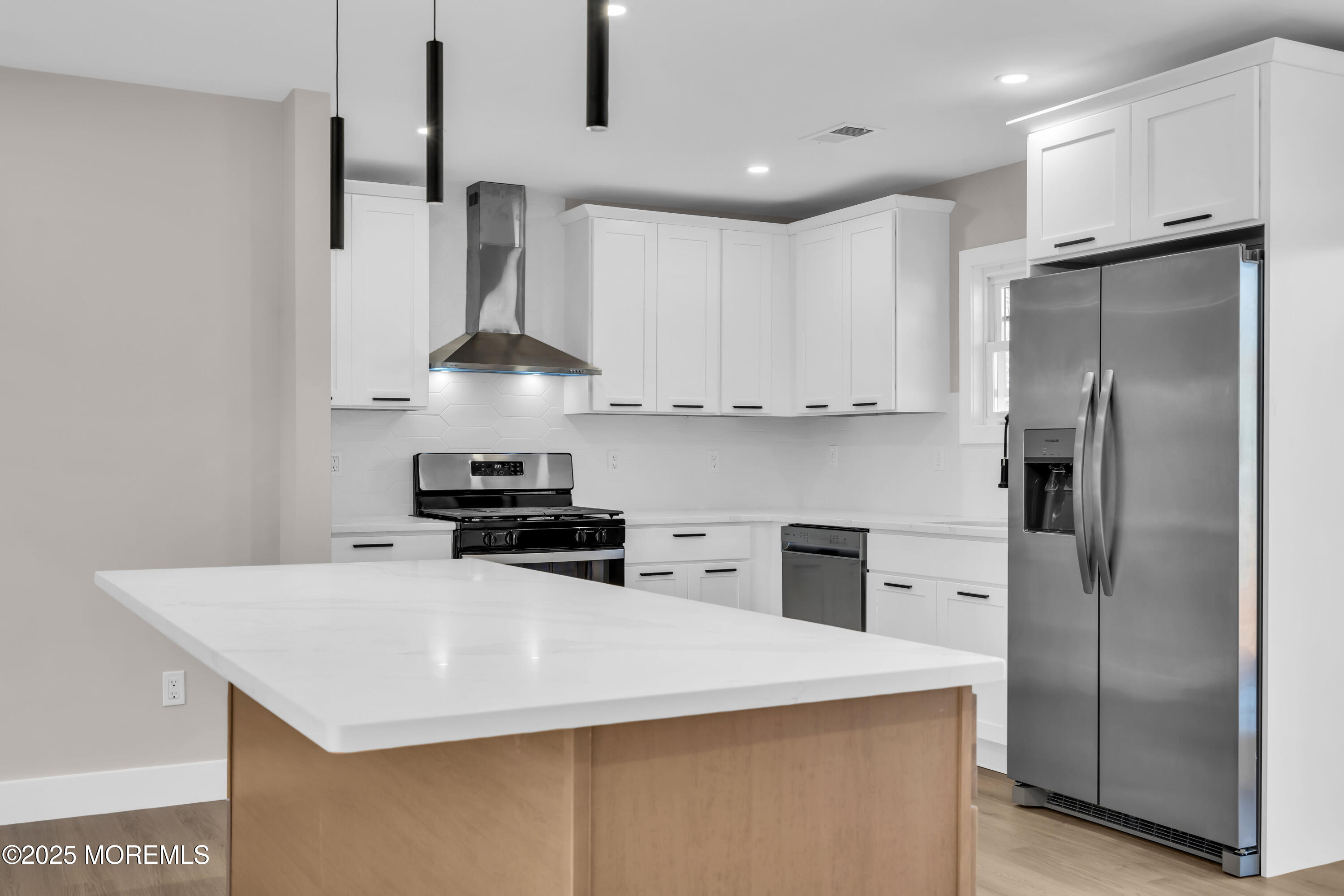 170 Station Road Bayville, NJ 08721 - Photo 3 of 36 a kitchen with stainless steel appliances a refrigerator and a stove