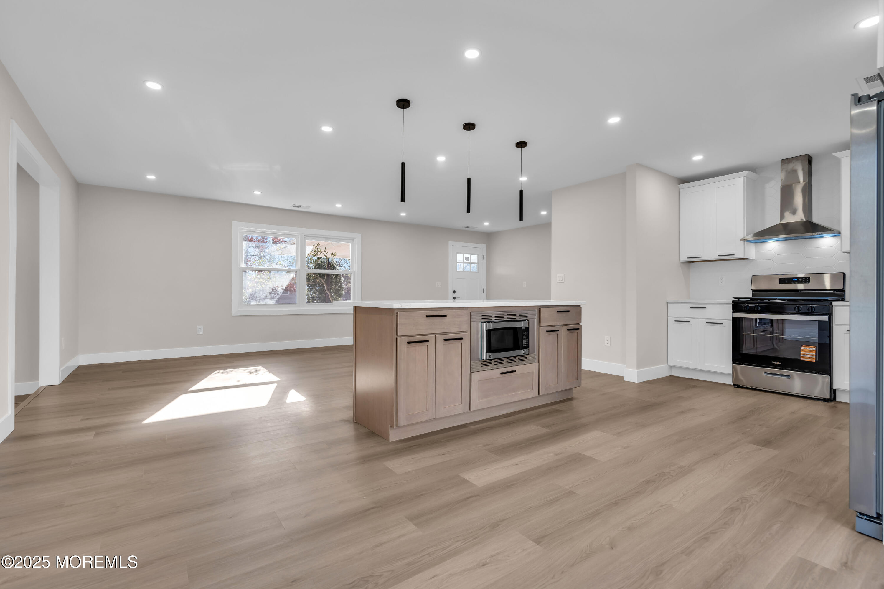 170 Station Road Bayville, NJ 08721 - Photo 36 of 36 a kitchen with stainless steel appliances granite countertop a stove a sink and a refrigerator