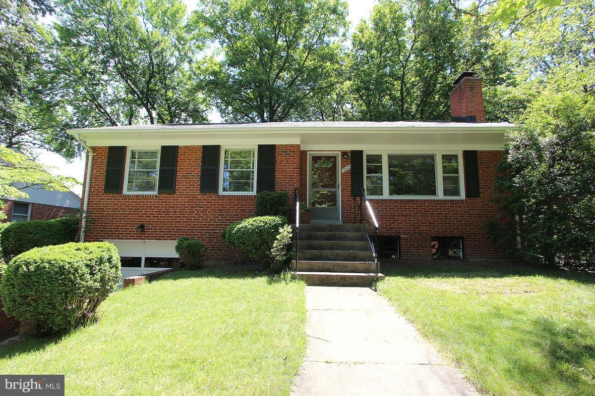 10109 Portland Place Silver Spring, MD 20901 - Photo 2 of 26 a front view of a house with a yard
