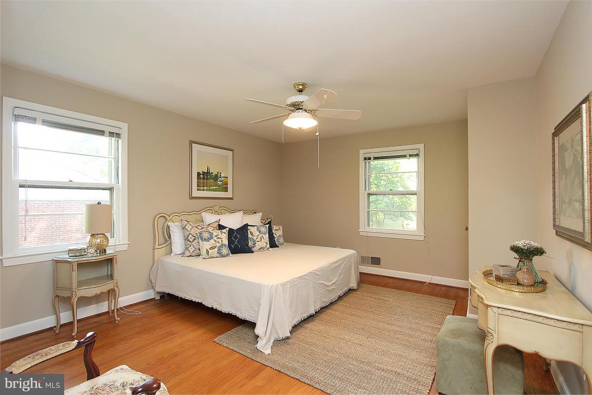 10109 Portland Place Silver Spring, MD 20901 - Photo 16 of 26 a spacious bedroom with a bed and window
