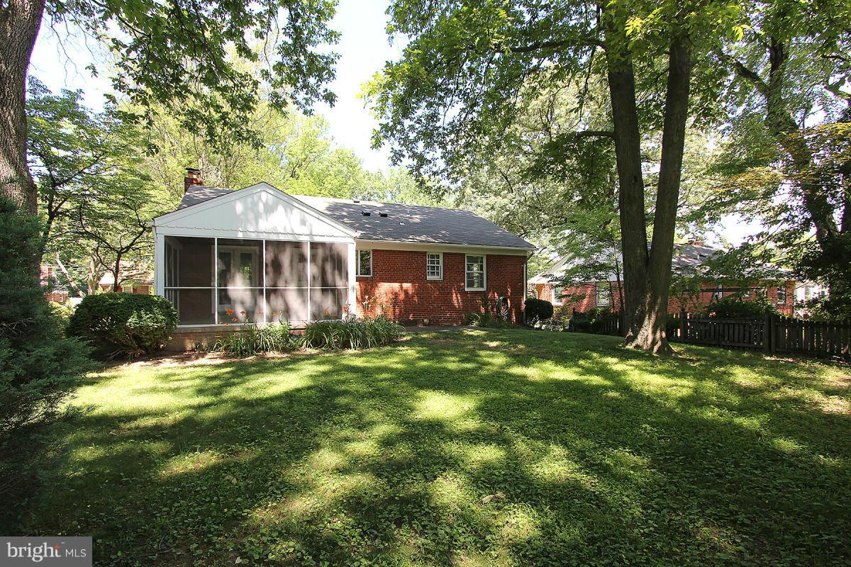 10109 Portland Place Silver Spring, MD 20901 - Photo 26 of 26 a front view of a house with a yard table and chairs