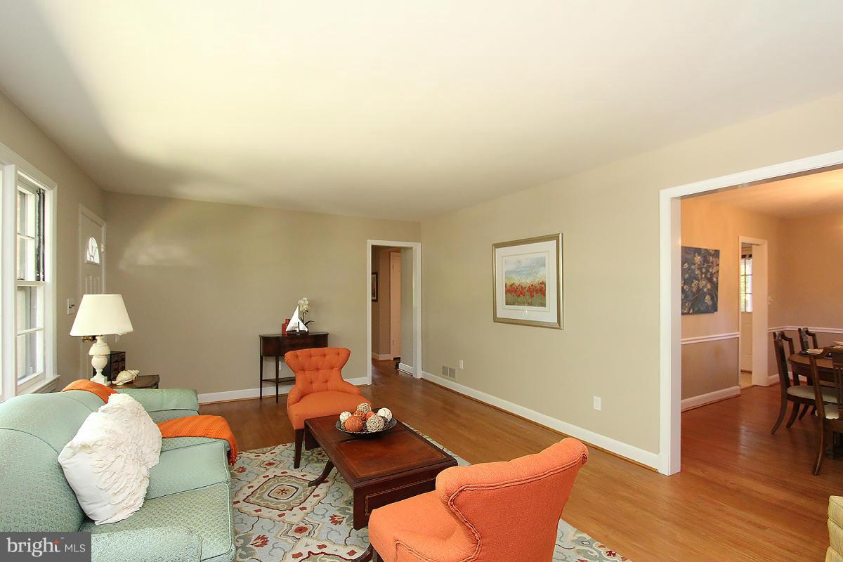 10109 Portland Place Silver Spring, MD 20901 - Photo 5 of 26 a living room with furniture and wooden floor