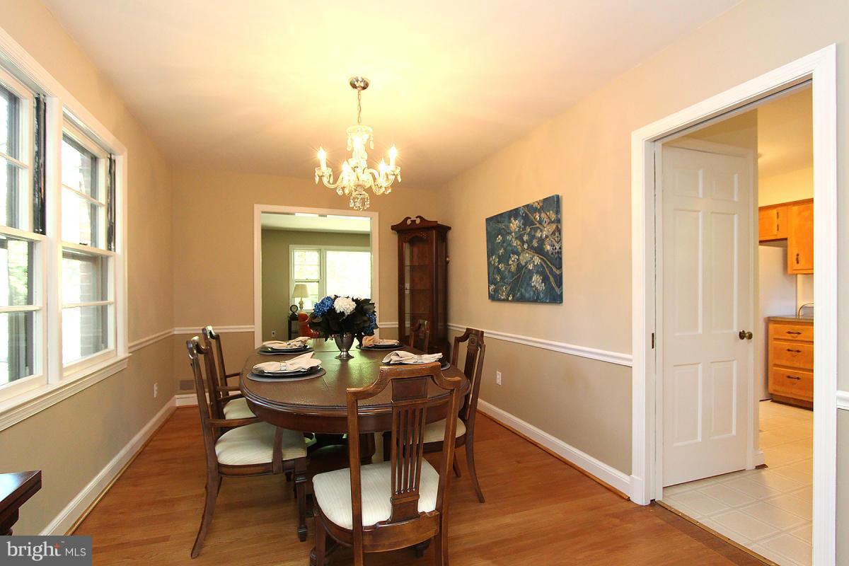 10109 Portland Place Silver Spring, MD 20901 - Photo 7 of 26 a view of a dining room with furniture window and wooden floor
