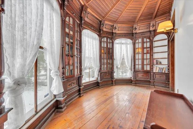 a view of an empty room and a window