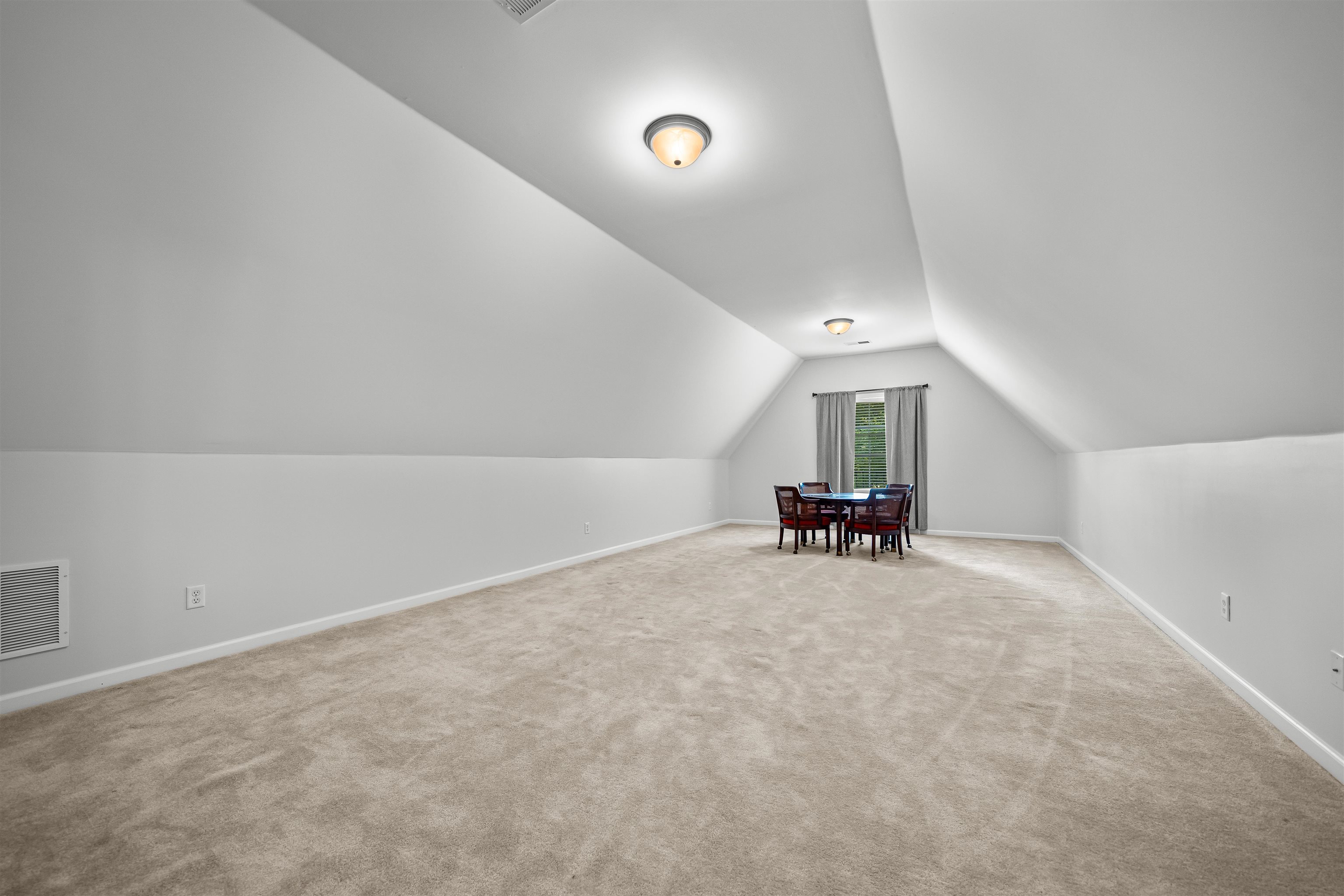 5035 Brian Ridge Road Arlington, TN 38002 - Photo 24 of 40 Expansive bonus room featuring sloped ceilings, plush carpeting, recessed window, and flush-mount lighting fixtures