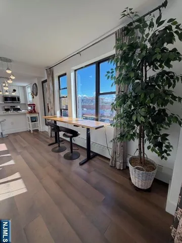 a kitchen with stainless steel appliances granite countertop a refrigerator sink and stove