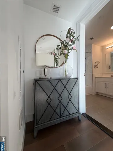 a bed room with a bed and a ceiling fan