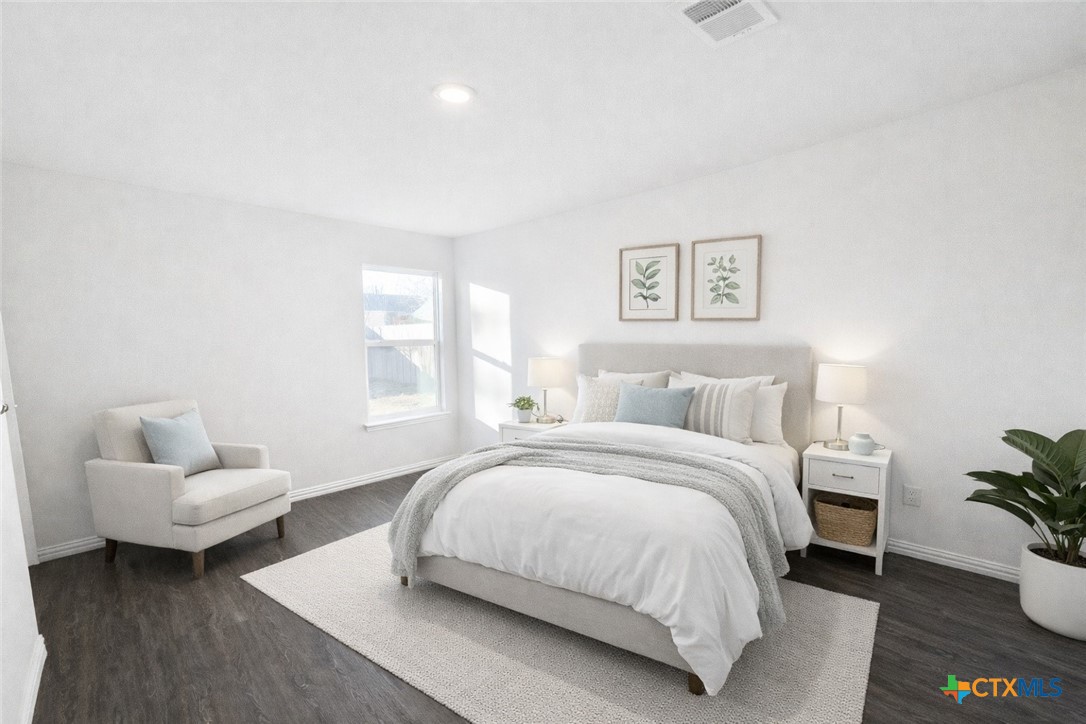 1411 North 10th Street Killeen, TX 76541 - Photo 13 of 21 a bedroom with a bed and a couch