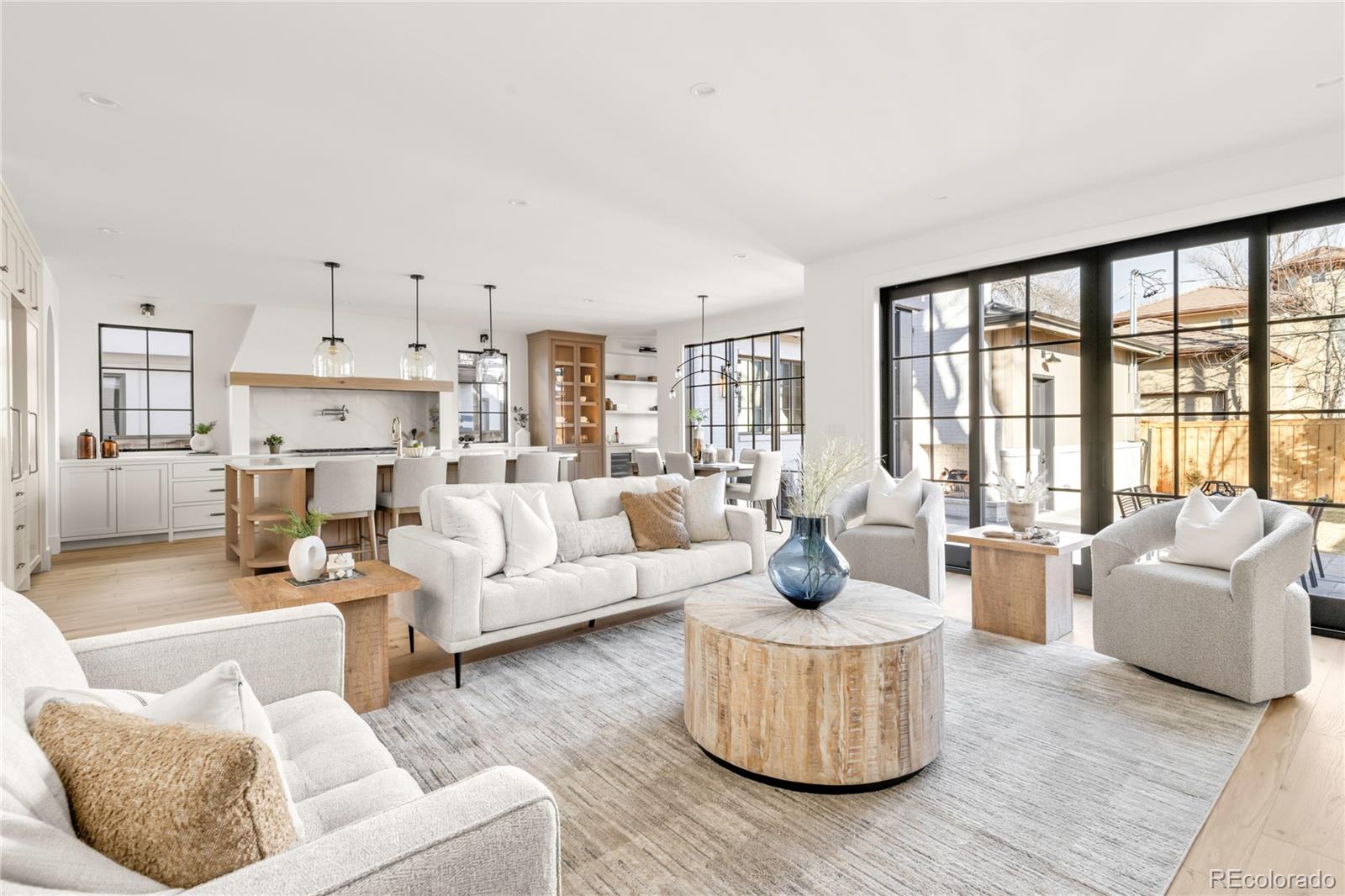 2658 South Adams Street Denver, CO 80210 - Photo 14 of 34 a living room with furniture and a large window
