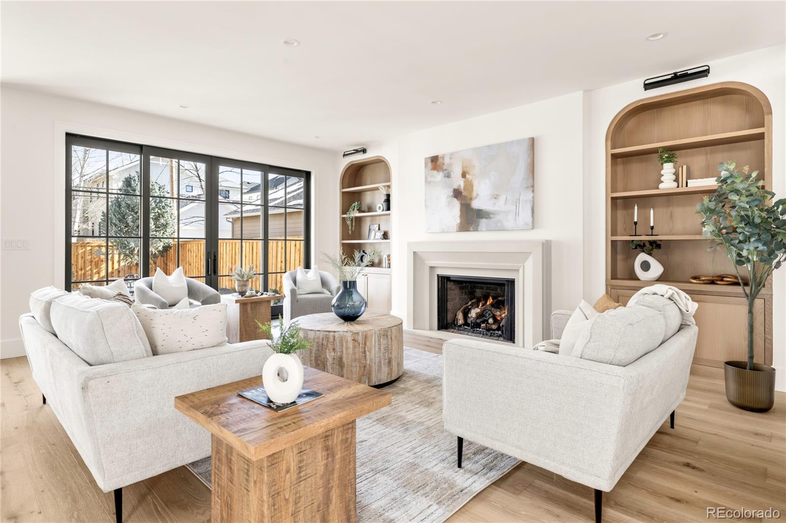 2658 South Adams Street Denver, CO 80210 - Photo 15 of 34 a living room with furniture fireplace and a large window