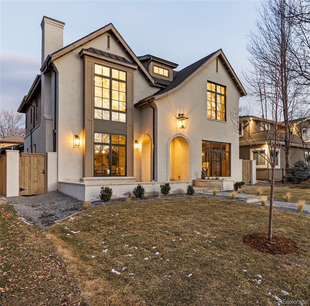 2658 South Adams Street Denver, CO 80210 - Photo 2 of 34 a front view of a house with a yard