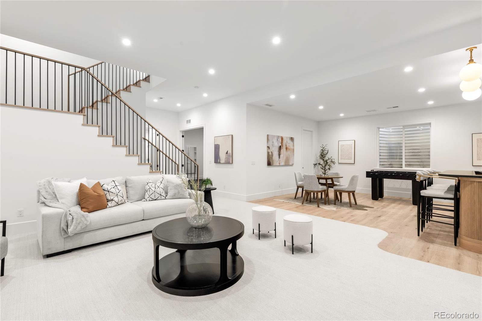 2658 South Adams Street Denver, CO 80210 - Photo 29 of 34 a living room with furniture and wooden floor