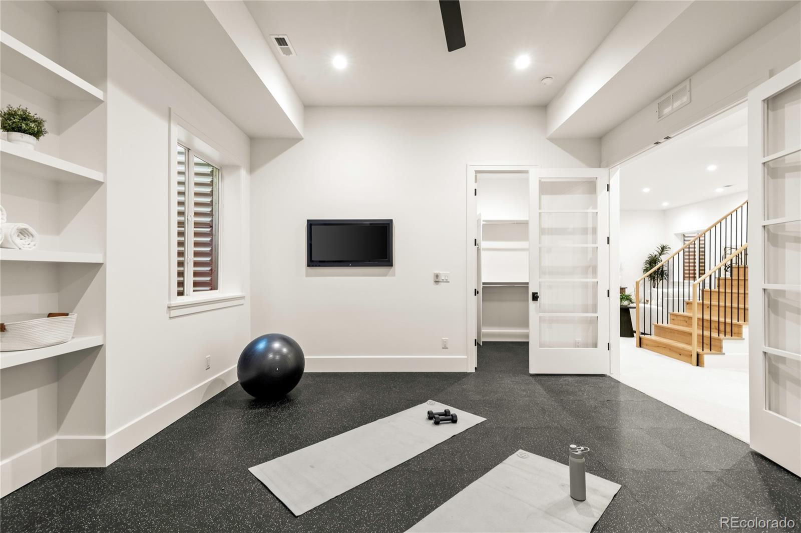 2658 South Adams Street Denver, CO 80210 - Photo 31 of 34 a living room with furniture and a flat screen tv