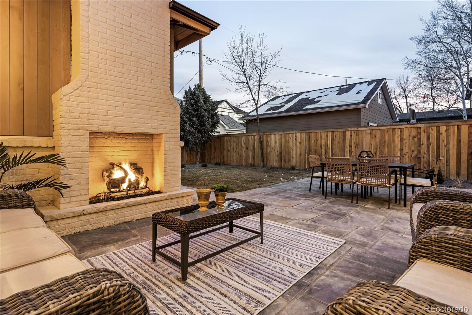 2658 South Adams Street Denver, CO 80210 - Photo 33 of 34 a view of a chairs and tables in the back yard of the house