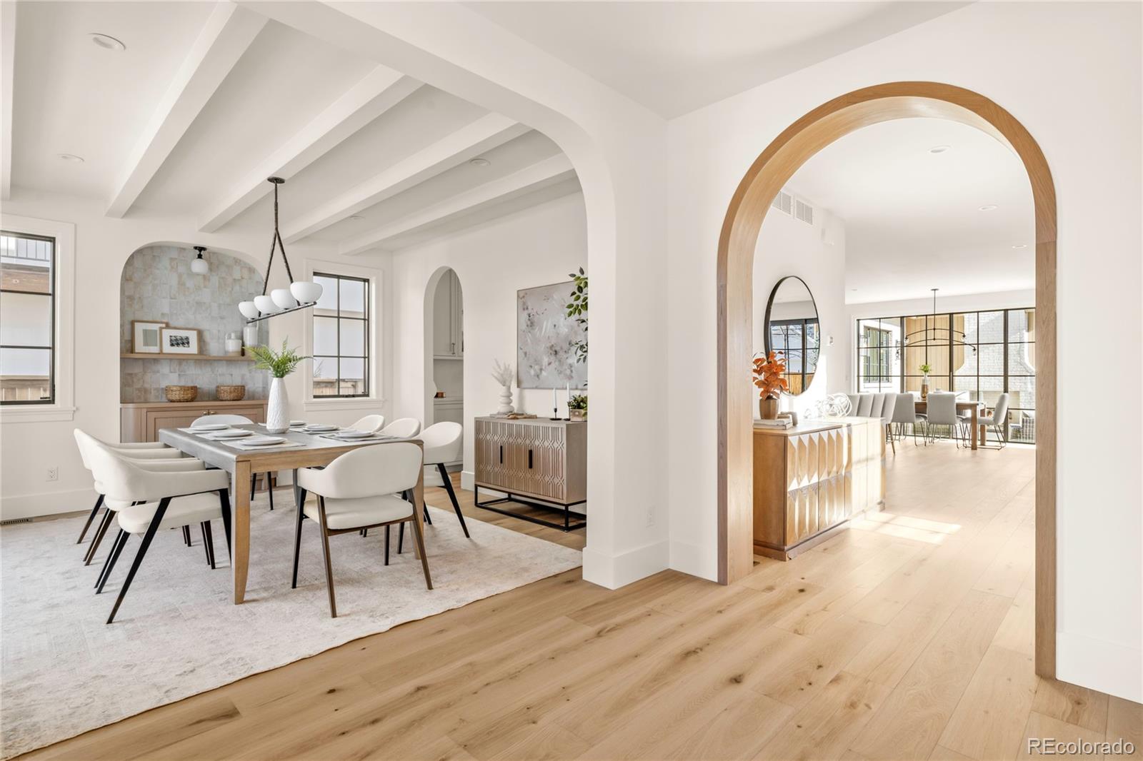 2658 South Adams Street Denver, CO 80210 - Photo 5 of 34 a view of a dining room with furniture and wooden floor