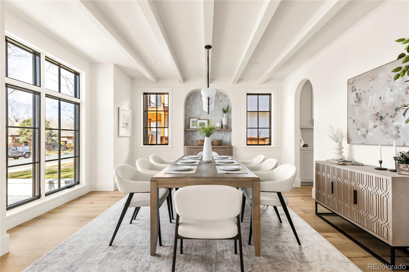 2658 South Adams Street Denver, CO 80210 - Photo 6 of 34 a view of a dining room with furniture and a large window