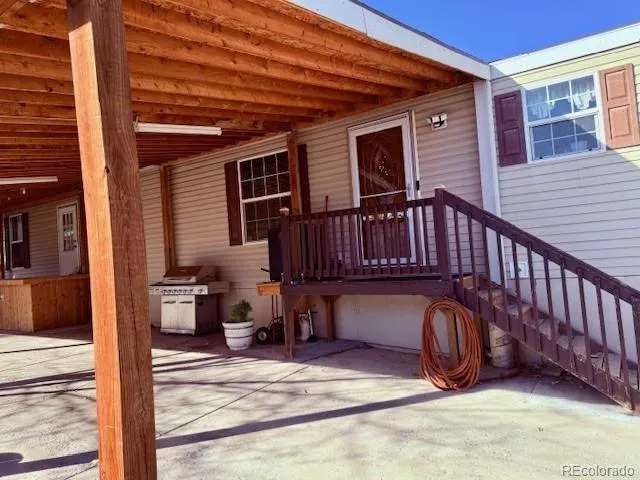 a view of a patio with a chairs and table in the patio