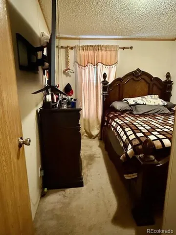 a bedroom with a bed and a closet