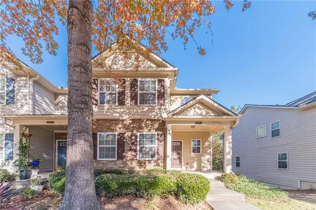 front view of a house with a garden