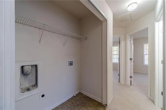 a view of a hallway with closet area