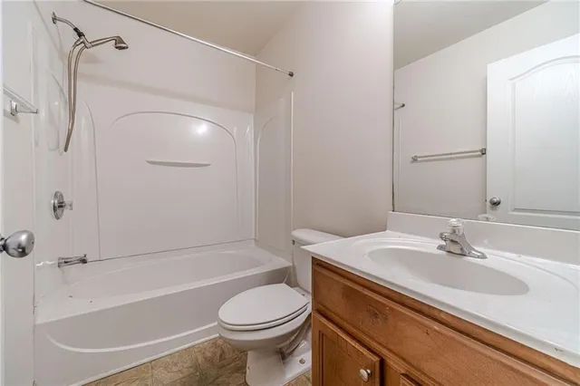 a bathroom with a sink a toilet and a bathtub