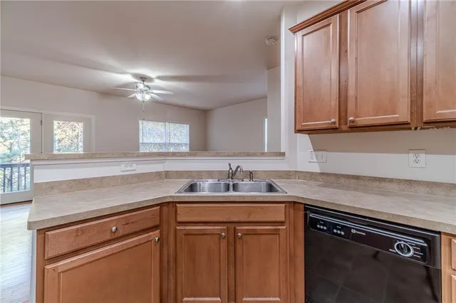a kitchen with a sink and cabinets
