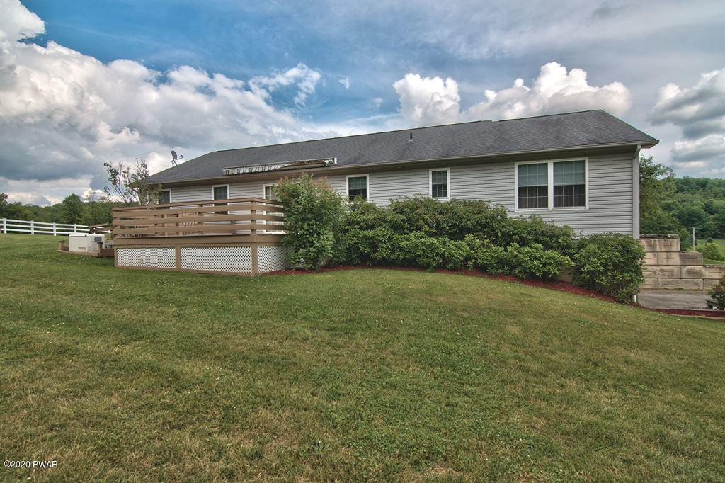 63 Callapoose Road Moscow, PA 18444 - Photo 61 of 73 a front view of a house with a yard