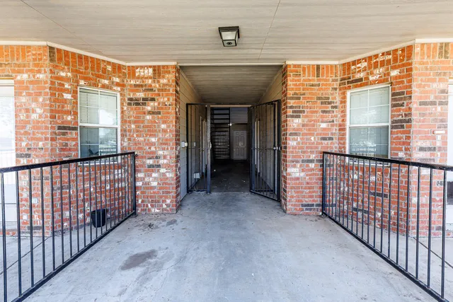 a view of entryway with a brick wall