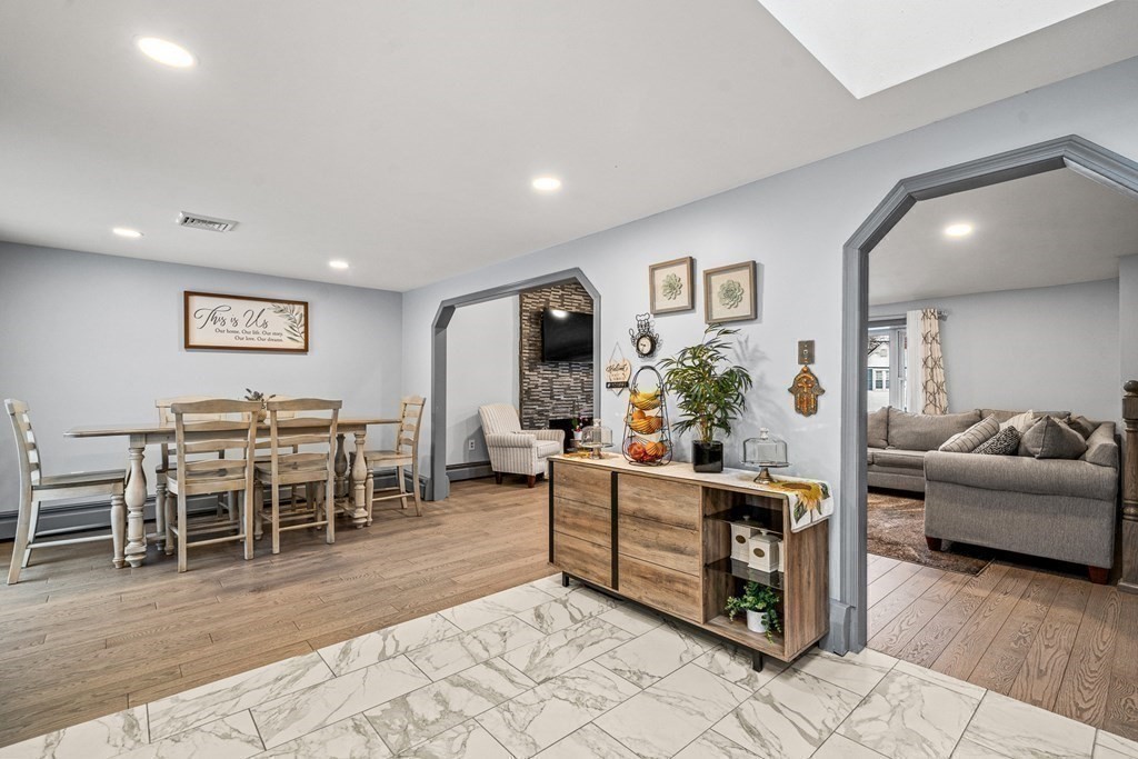 28 Sycamore Road Methuen, MA 01844 - Photo 12 of 35 a living room with furniture and a dining table