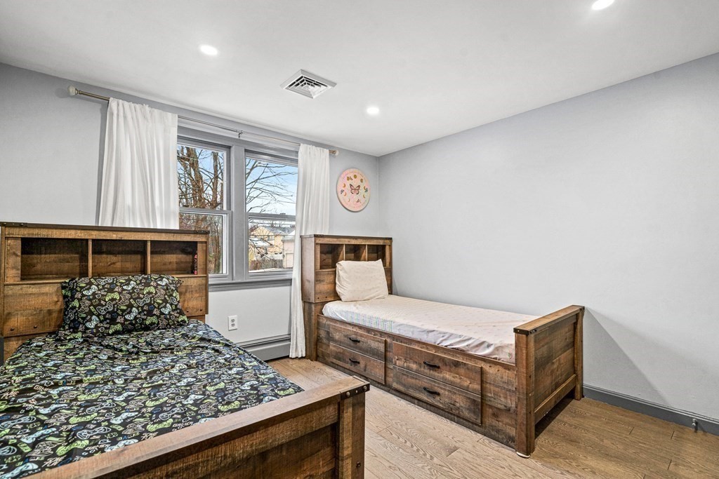 28 Sycamore Road Methuen, MA 01844 - Photo 15 of 35 a bedroom with a bed and a dresser