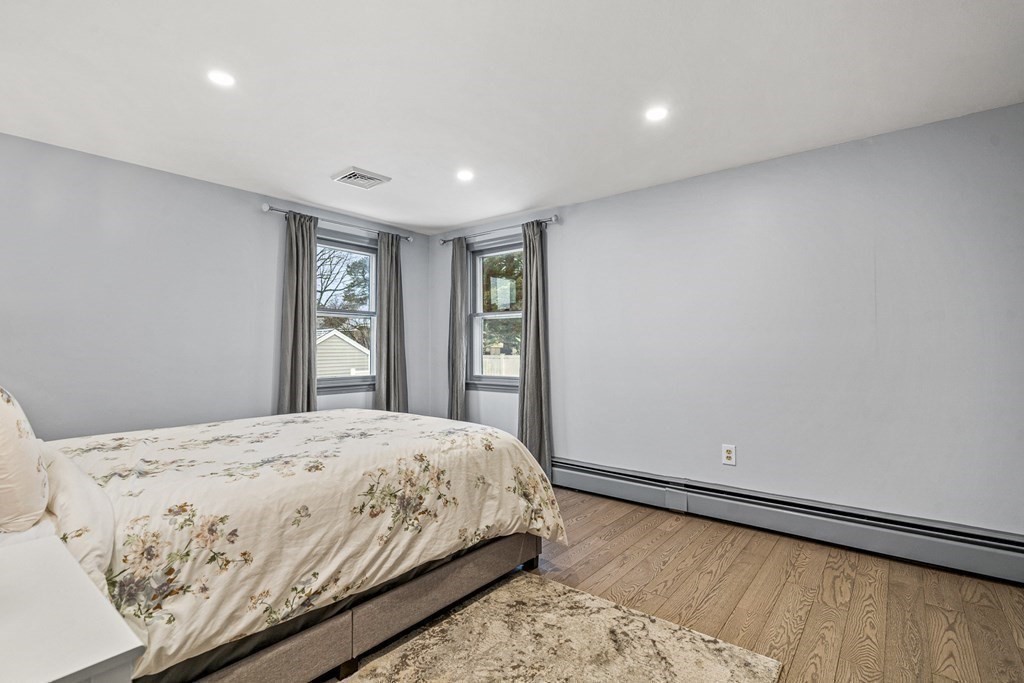 28 Sycamore Road Methuen, MA 01844 - Photo 18 of 35 a bedroom with a large bed and a window