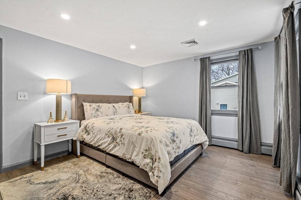 28 Sycamore Road Methuen, MA 01844 - Photo 19 of 35 a bedroom with a bed and a lamp