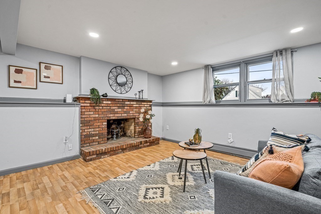 28 Sycamore Road Methuen, MA 01844 - Photo 22 of 35 a living room with furniture and a fireplace
