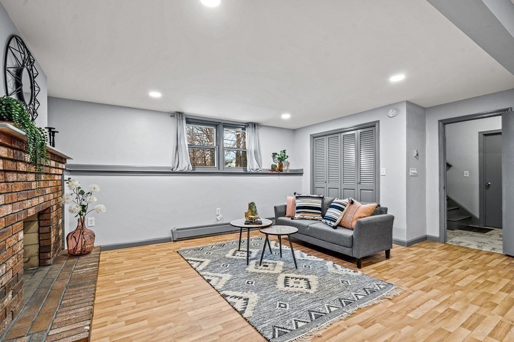 28 Sycamore Road Methuen, MA 01844 - Photo 23 of 35 a living room with furniture and a wooden floor