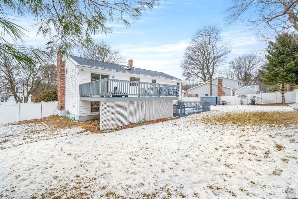 28 Sycamore Road Methuen, MA 01844 - Photo 32 of 35 a view of a white house with a snow on the road