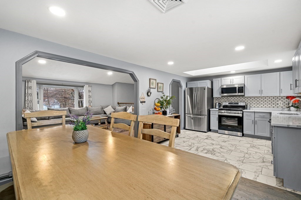 28 Sycamore Road Methuen, MA 01844 - Photo 8 of 35 a large white kitchen with lots of counter space and stainless steel appliances