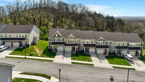 an aerial view of a house with a garden and plants