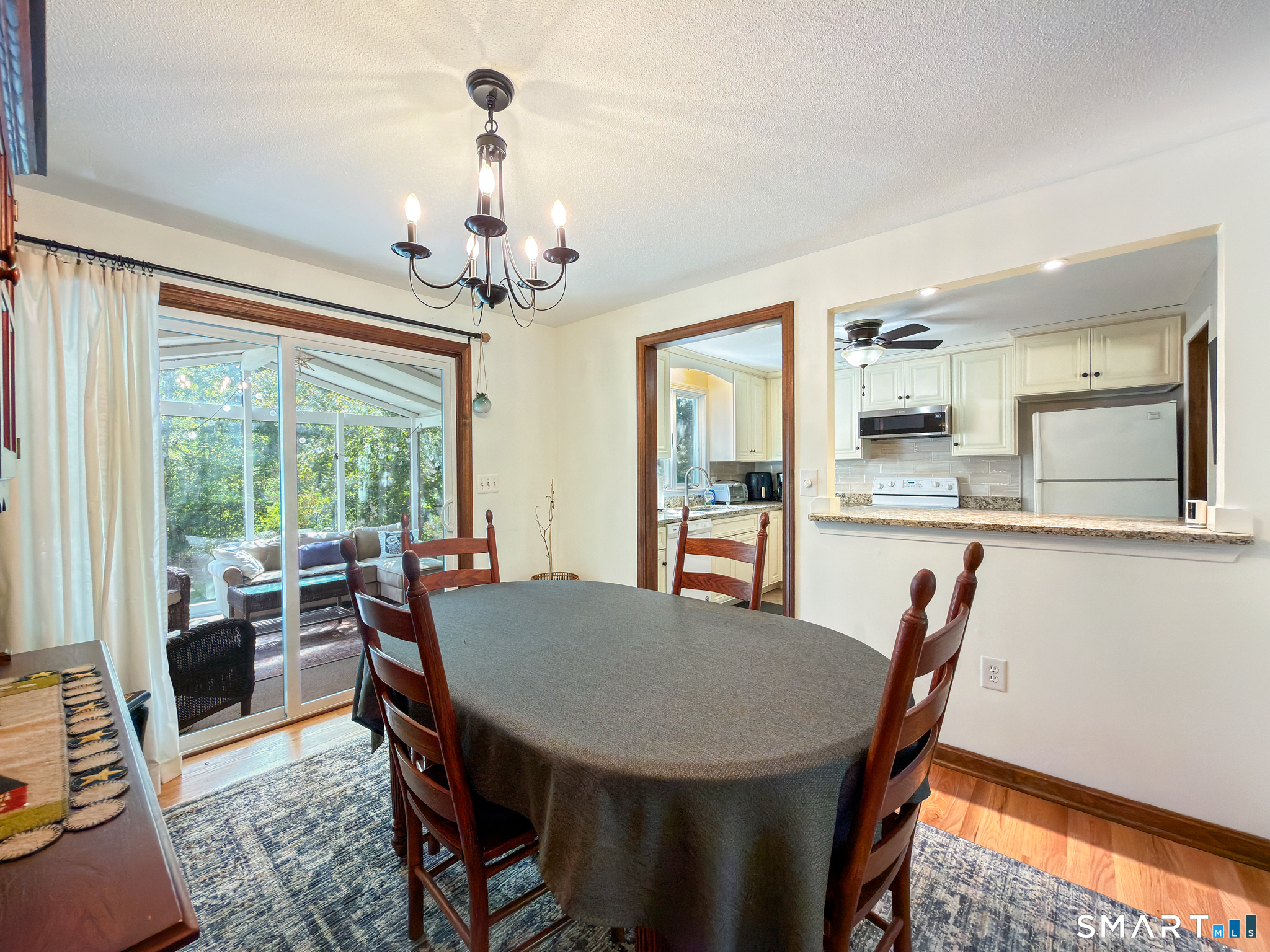 5 Rio Road Burlington, CT 06013 - Photo 10 of 40 Separate dining room with slider access to sun porch