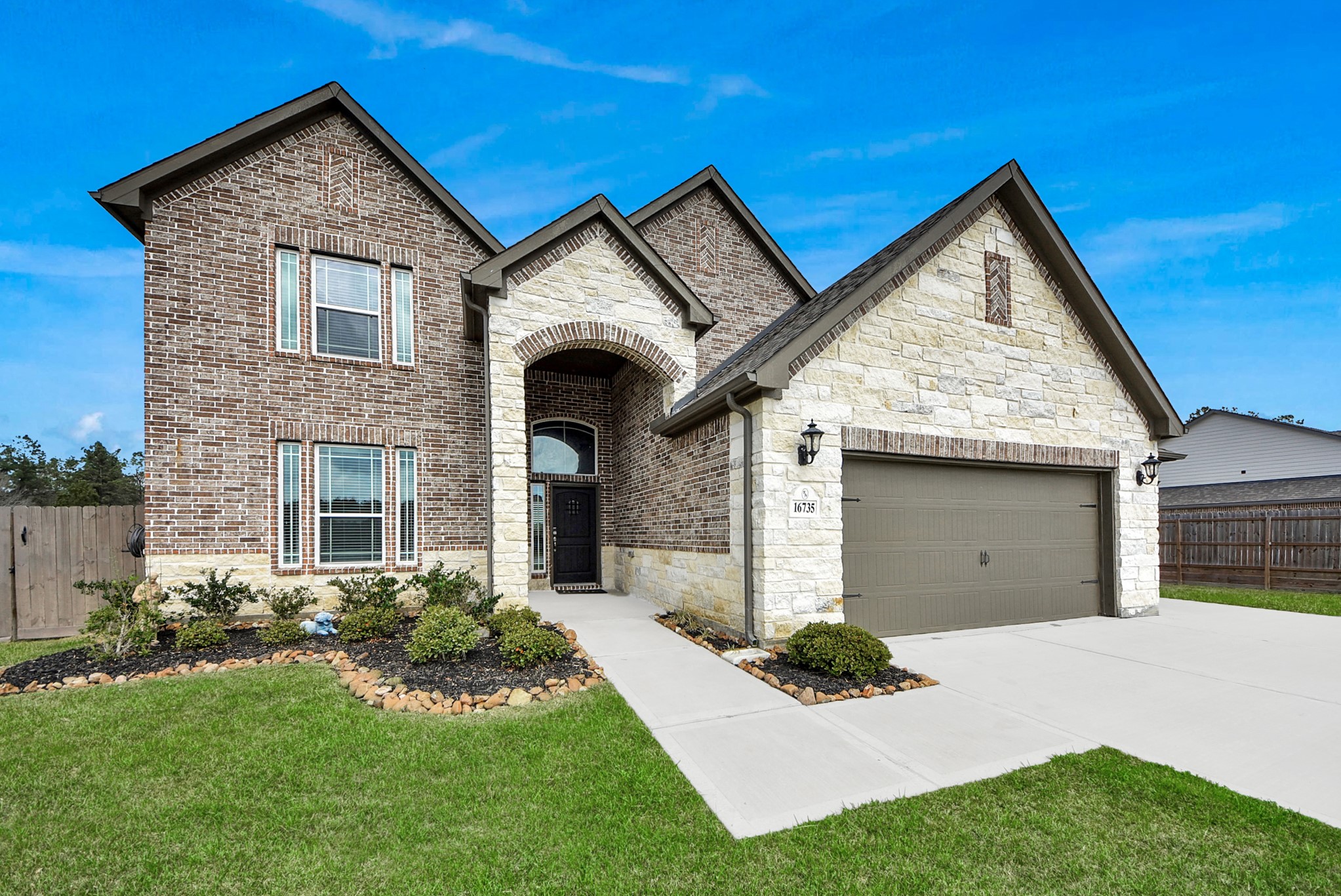 16735 Rockwall Street Conroe, TX 77303 - Photo 1 of 37 Built in 2022, this stunning home showcases the advantages of nearly new construction without the wait, combining modern craftsmanship, high-quality materials, and thoughtfully curated finishes throughout.