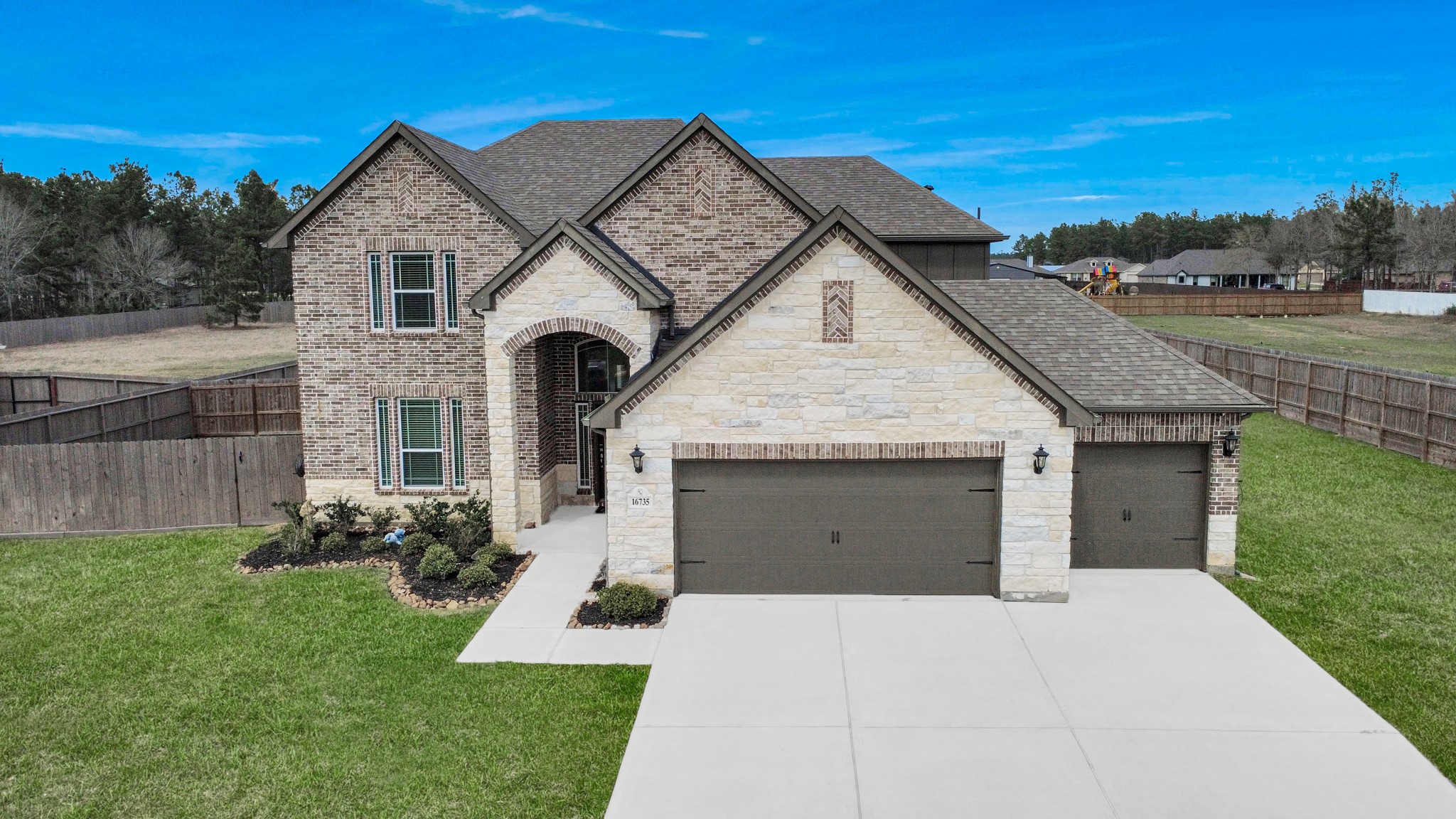 16735 Rockwall Street Conroe, TX 77303 - Photo 3 of 37 nside, the residence has been carefully designed to support today’s lifestyles, blending elegance with everyday functionality.