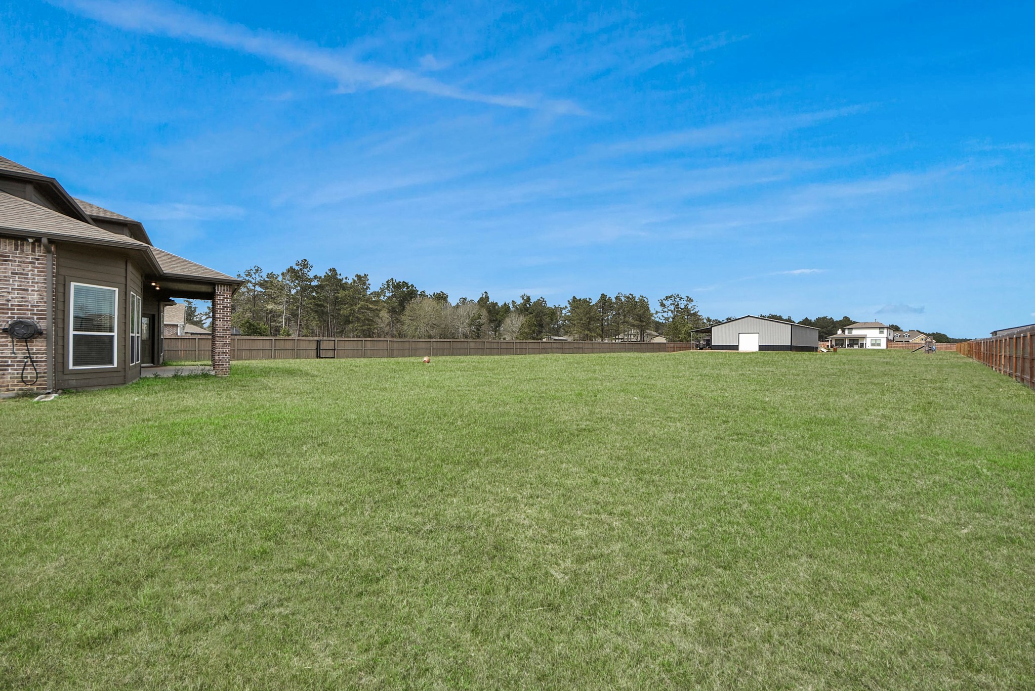 16735 Rockwall Street Conroe, TX 77303 - Photo 30 of 37 Situated on a spacious one-acre lot, this property offers the perfect balance of open space and peaceful surroundings.
