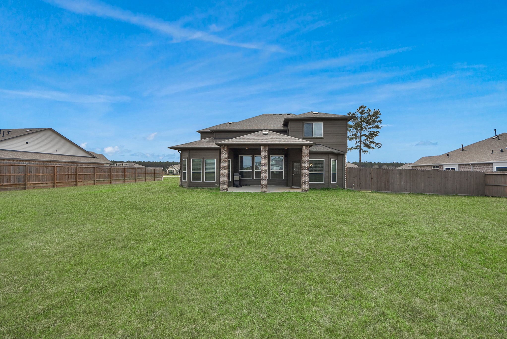 16735 Rockwall Street Conroe, TX 77303 - Photo 33 of 37 This shaded space is perfect for enjoying morning coffee, outdoor dining, or unwinding in the evenings while taking in the quiet views of the surrounding property.