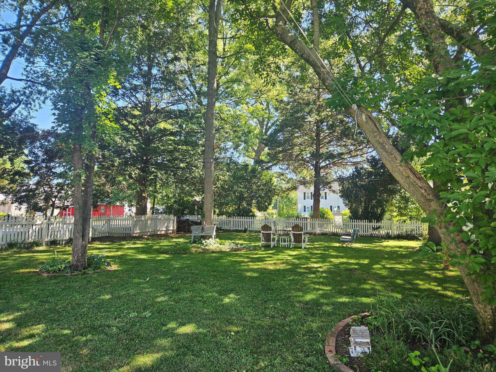 202 Central Avenue Ridgely, MD 21660 - Photo 21 of 22 Serene garden retreat under trees.