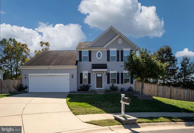 a view of a house with potted plants