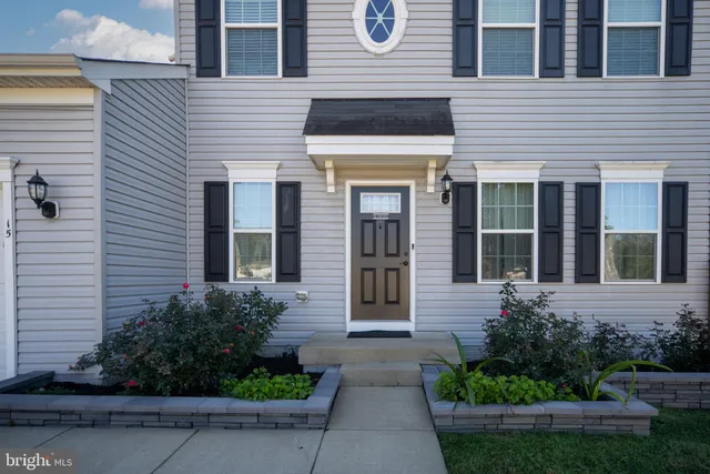a kitchen with granite countertop a sink and a window